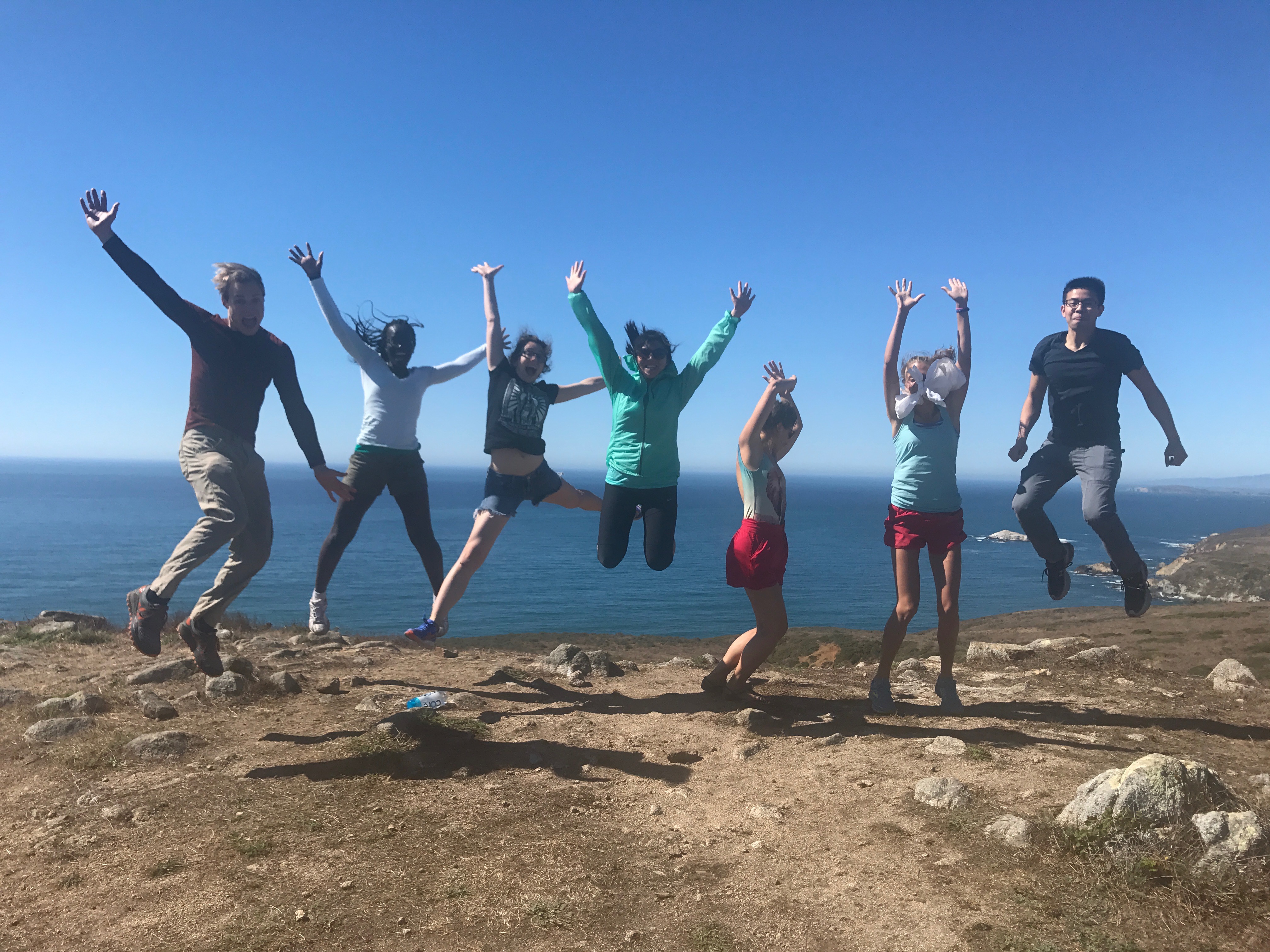 Resident Group Photo Jumping at a Hiking Spot